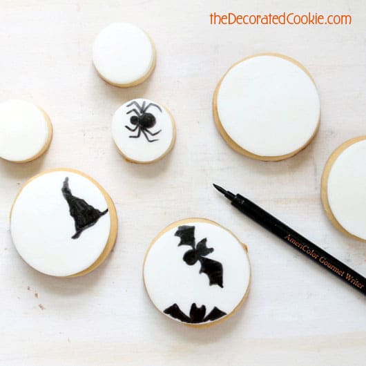 Make easy decorated Halloween cookies with just fondant and one black food coloring pen. Fun food for Halloween. Sweet Halloween treat idea.