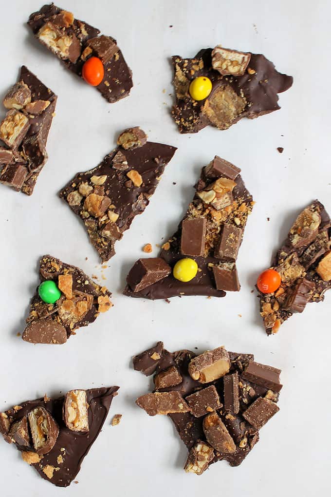 Use leftover Halloween candy bars to make chocolate bark. A great way to use all of your leftover candy to make a new dessert.