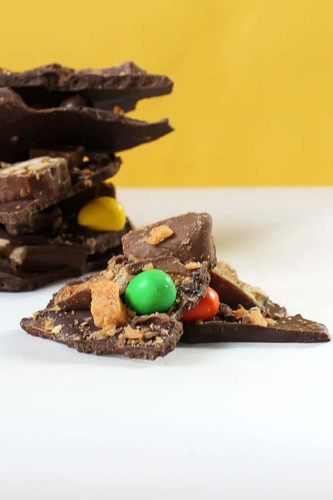 Use leftover Halloween candy bars to make chocolate bark. A great way to use all of your leftover candy to make a new dessert.