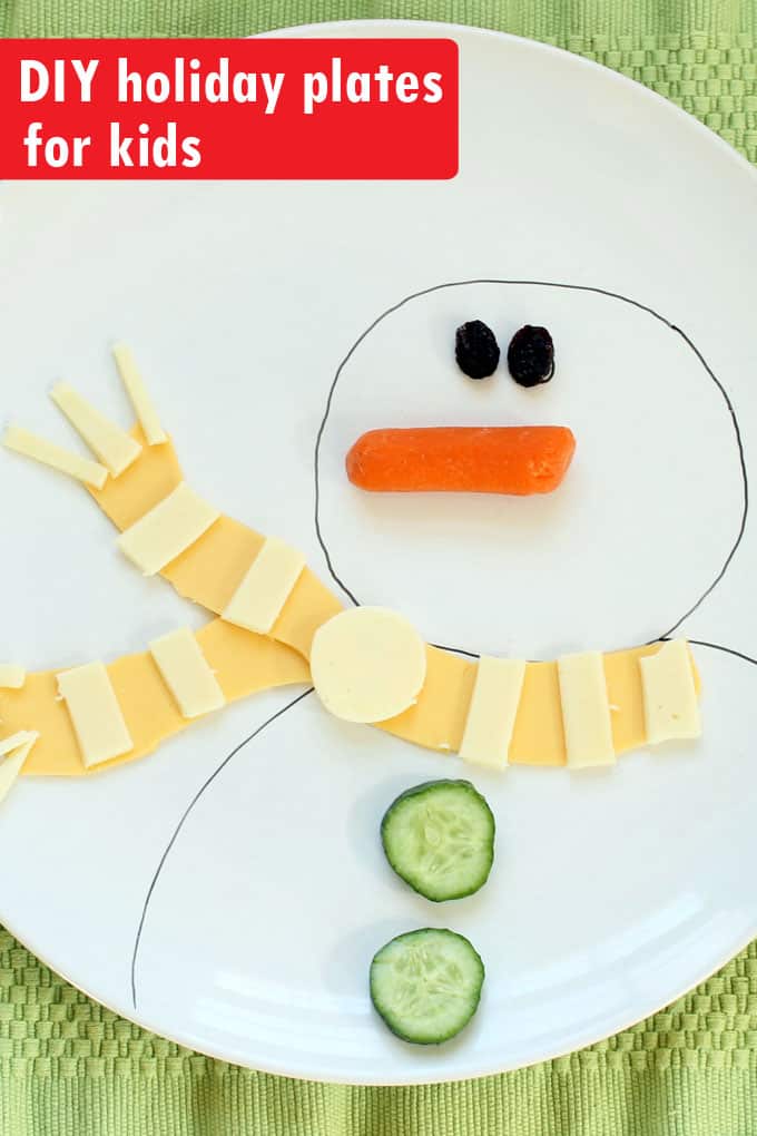 Draw Christmas and winter scenes on plates for kids to create food art. DIY Christmas plates from inexpensive plain white dishes and a China Paint Pen. 