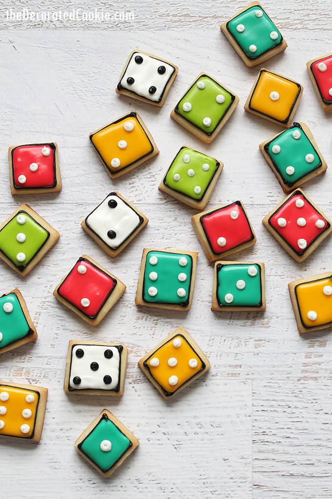 colorful bite-size DICE COOKIES, a fun food idea for game night. Recipes for cut-out sugar cookies, royal icing, and how to color icing.