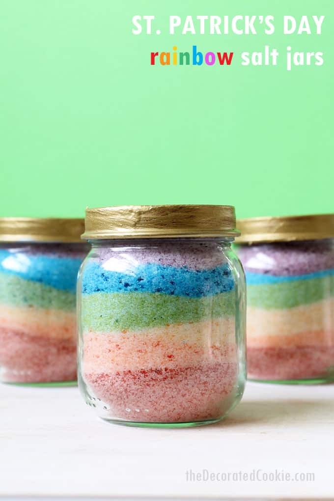 St. Patrick's Day craft for kids-- RAINBOW SALT JARS -- Paint mini jar lids gold and fill the jars with rainbow-colored salt. Rainbow art!