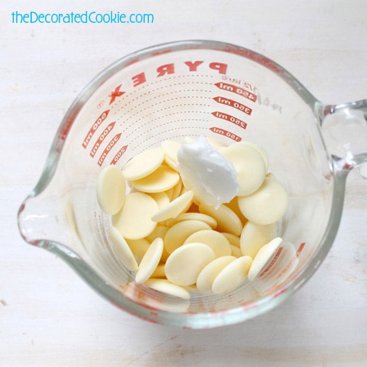 white candy melts in measuring cup 