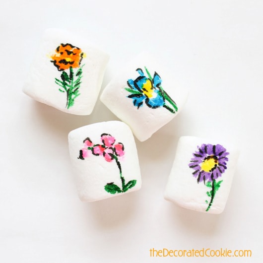 25 flowers drawn on marshmallows