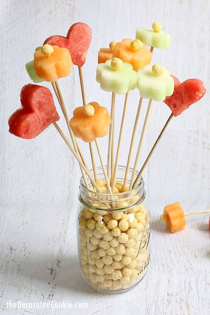 How to make a flower fruit bouquet, a fun food idea for Spring or Mother's Day. Mini flower cookie cutters cut out watermelon and melon.