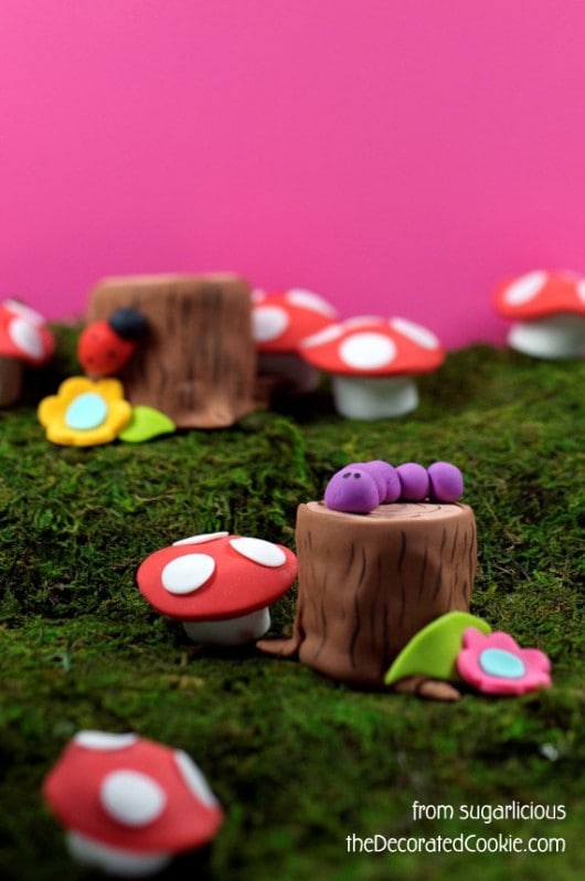 Create a fairy woodland with petits fours and marshmallows. 
