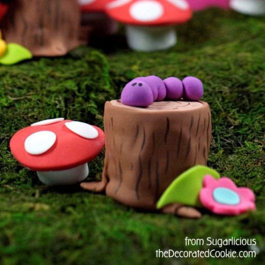 Create a fairy woodland with petits fours and marshmallows. 