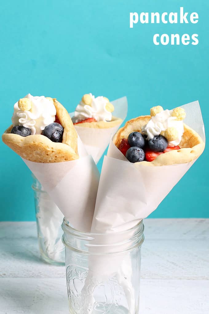 PANCAKE CONES for a handheld, to-go breakfast idea, a fun food idea for kids. Fill with strawberries and whipped cream for a treat.