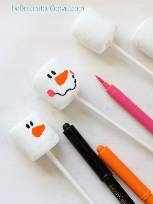 decorating marshmallow snowmen 