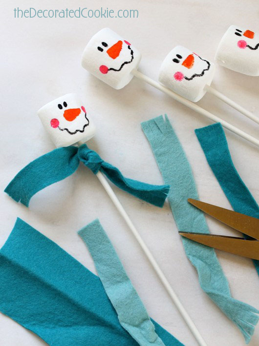 snowman marshmallows adding scarves