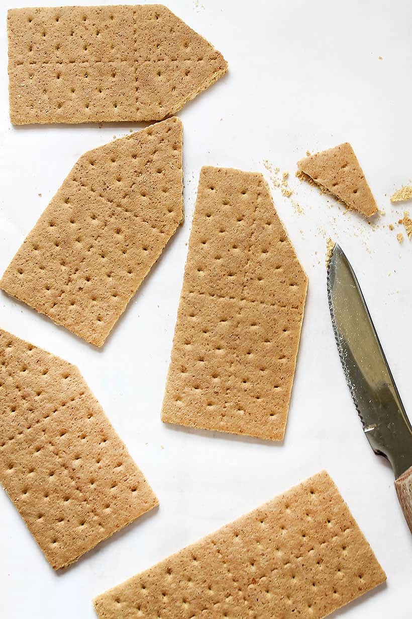 assembling graham cracker gingerbread house