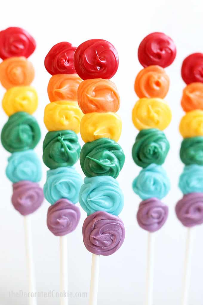 Simple rainbow candy pops -- how to make chocolate rainbow lollipops. Great for rainbow and unicorn parties, or St. Patrick's Day.