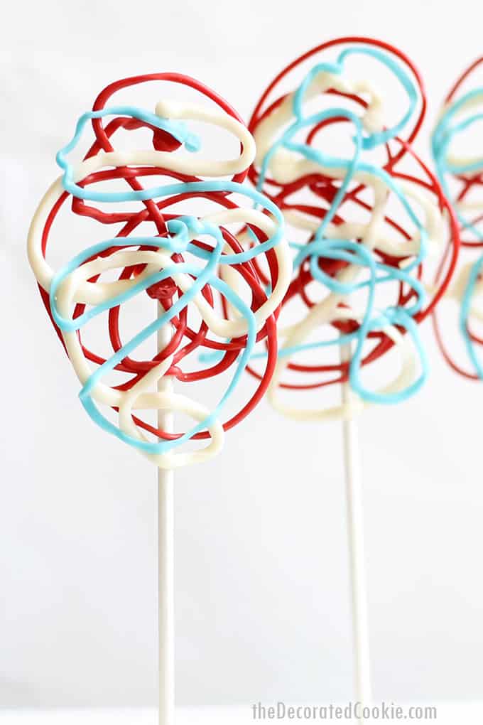 red, white, and blue chocolate lollipops 