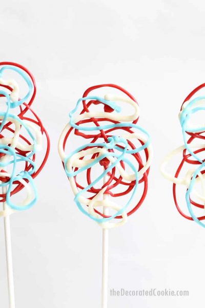 red, white, and blue chocolate lollipops