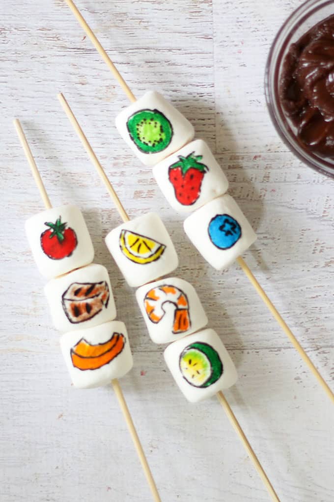 Summer party food idea: Make fun marshmallow kabobs with chocolate dip using food coloring pens, marshmallows, and skewers. Video included.