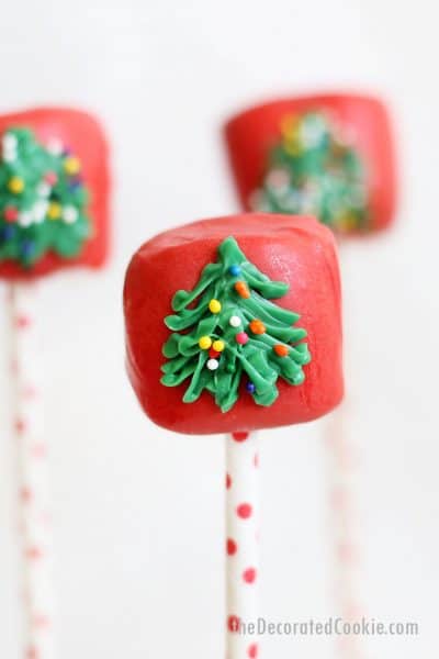 marshmallows dipped in red candy melts and decorated with Christmas tree