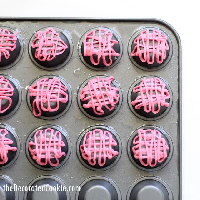 Valentine's Day candy cups by the decorated cookie 