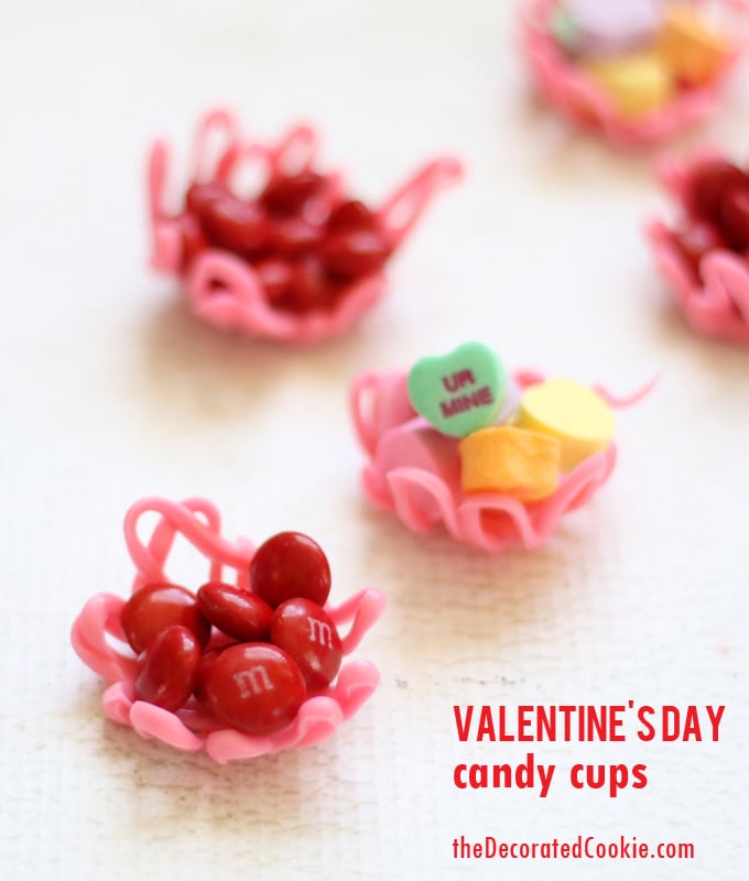 Valentine's Day candy cups by the decorated cookie 