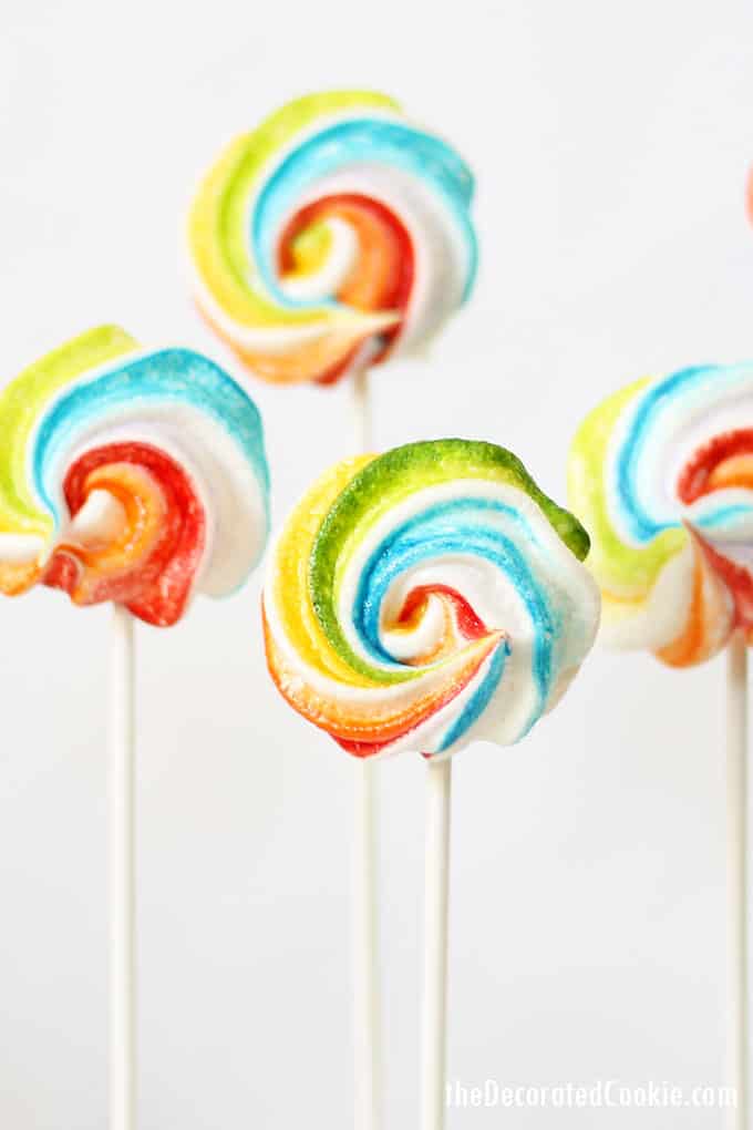 RAINBOW MERINGUE COOKIES on a stick. These colorful, easy cookie pops are perfect for a rainbow party or unicorn food idea.