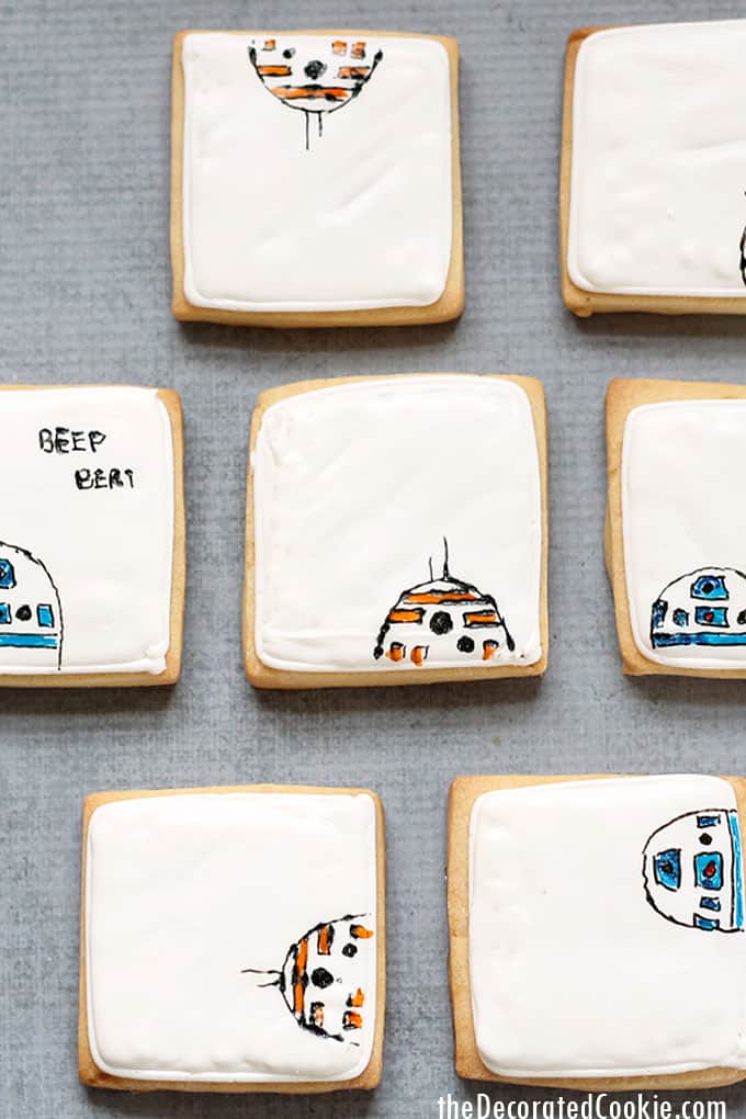 How to make and decorate Star Wars droid cookies with royal icing and food writers. A fun food idea for a Star Wars party.