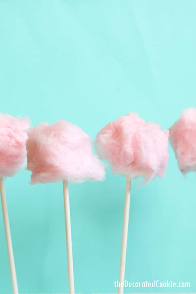 cotton candy marshmallow pops -- wrap marshmallows with store-bought cotton candy for a fun treat for Valentine's Day or for a carnival-themed party #valentinesday #cottoncandy #pink #funfood #carnival #party #marshmallows 