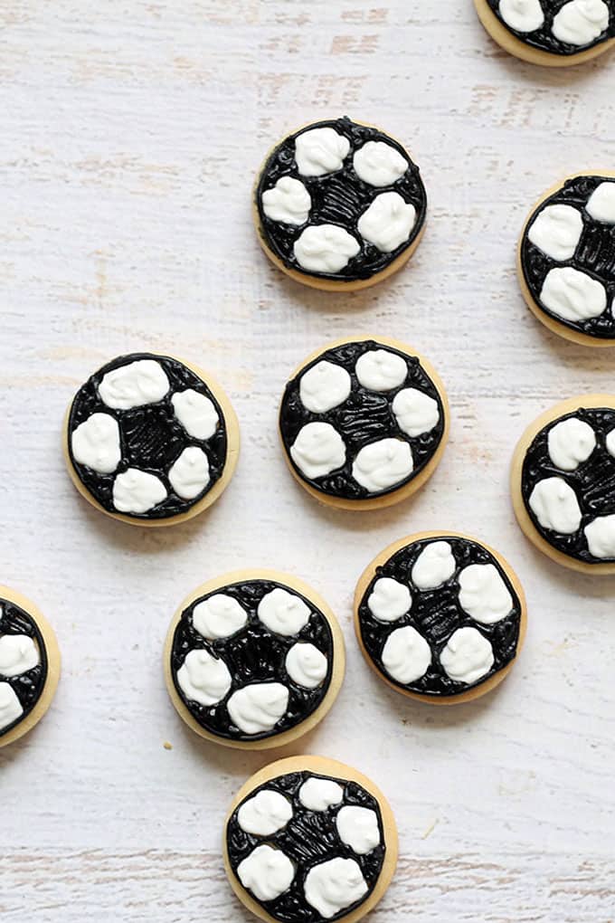 SOCCER BALL COOKIES -- mini decorated cookies for a soccer player or sports-themed party. Also, how to draw a soccer ball.