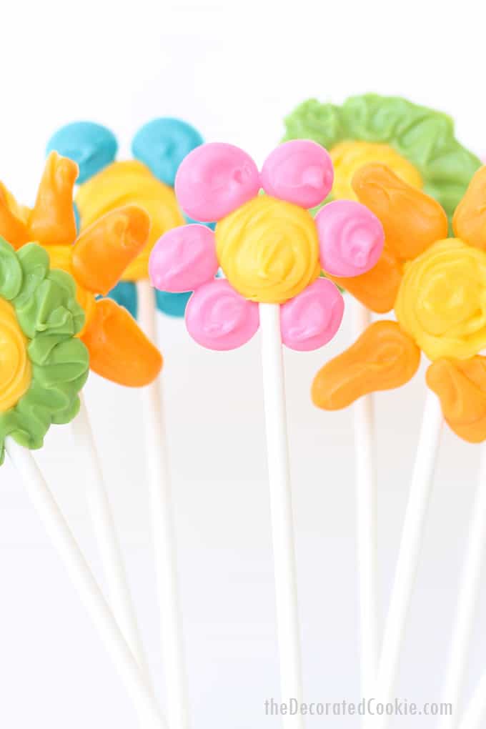 Easiest ever candy flower pops, a cute spring treat kids can make for Mother's Day with colorful candy melts. Video tutorial included.