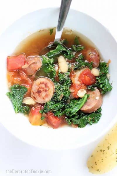 bowl of chicken sausage, kale, and white bean soup
