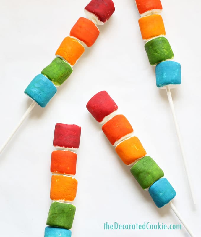 painted rainbow marshmallows, a fun unicorn food idea