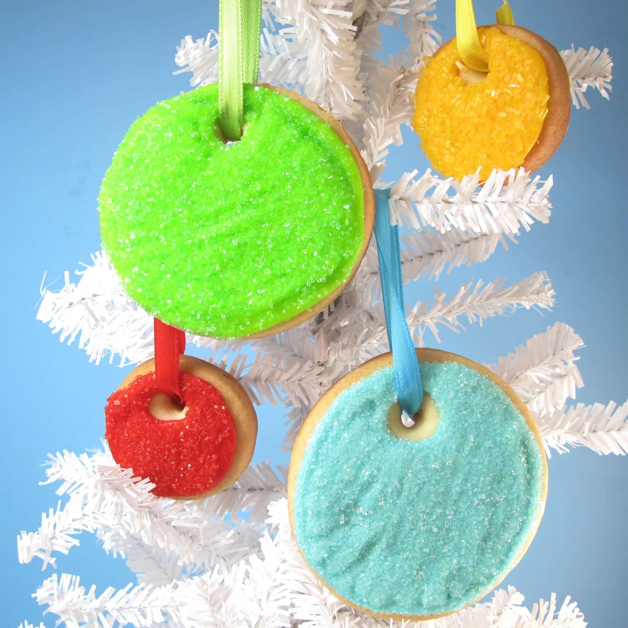 sparkly Christmas ornament cookies simply decorated with sprinkles