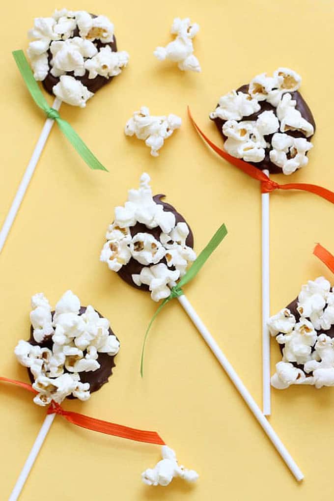 Combine popcorn and chocolate for a simple, fun food treat idea: Chocolate popcorn pops! Kid-friendly treats -- fun for Halloween or Thanksgiving.