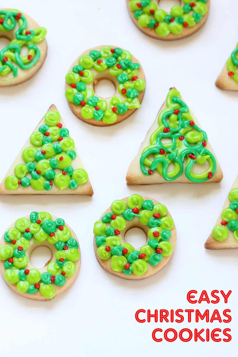 Christmas cookies decorated as trees and wreaths with royal icing 