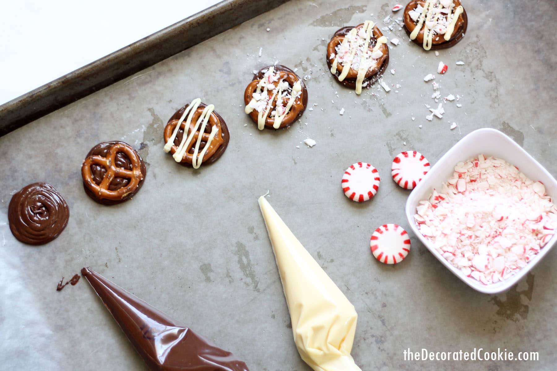 making chocolate pretzels peppermint bark on baking tray 