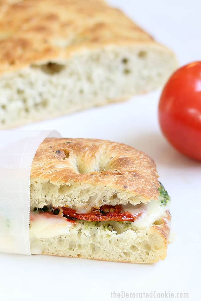 Make a homemade Starbucks panini with roasted tomatoes, pesto, spinach, and mozzarella cheese. A delicious lunch idea. Starbucks sandwiches.
