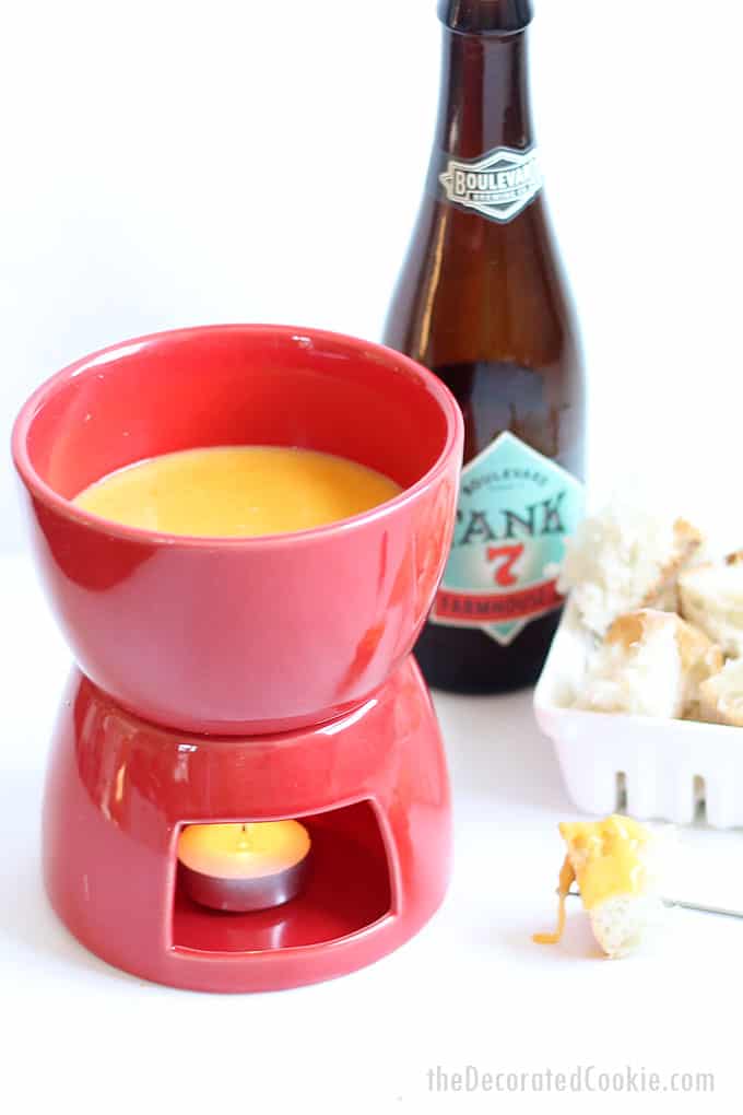 This easy BEER AND CHEESE FONDUE tastes delicious and takes no time at all to make. The perfect appetizer for any party.  Dip pretzels, bread, whatever.