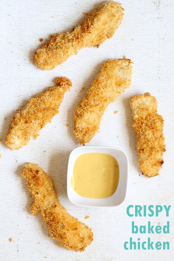 Tips and tricks to make extra crispy baked chicken strips with panko bread crumbs. An easy weeknight dinner idea. Video recipe included.
