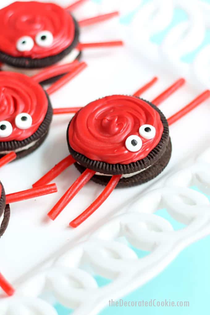 Oreo crabs with red candy melts and licorice legs