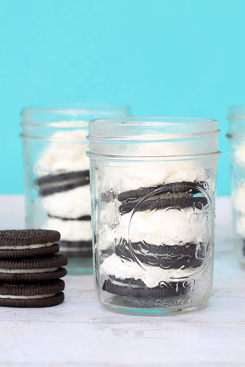 Oreo ice box cake in a jar with whipped cream