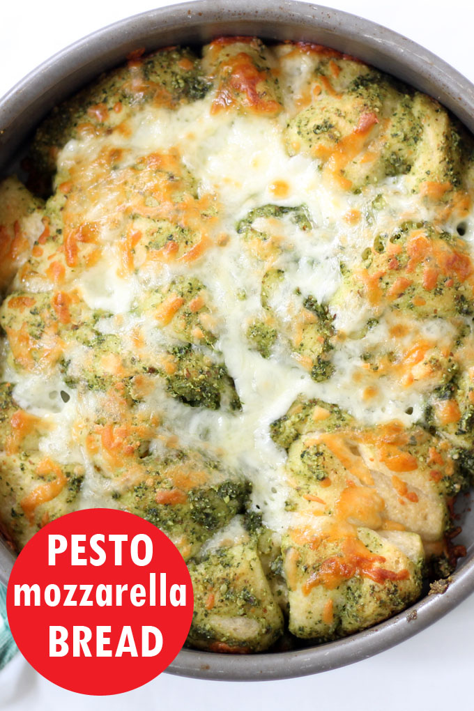 easy pesto mozzarella pull-apart bread is an amazing party appetizer recipe. Four-ingredients, including store-bought bread and pesto. #pesto #appetizer #pullapartbread 