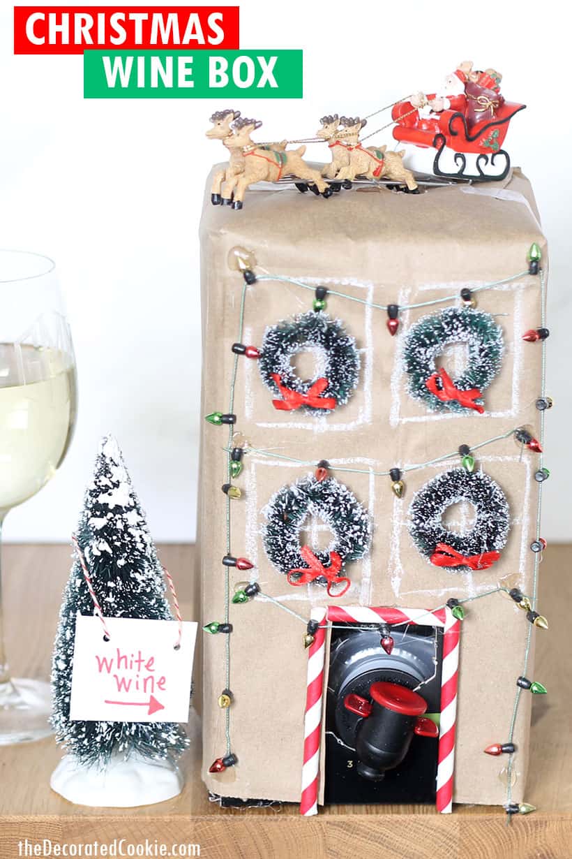 Box of wine decorated as Christmas townhouse for Christmas party