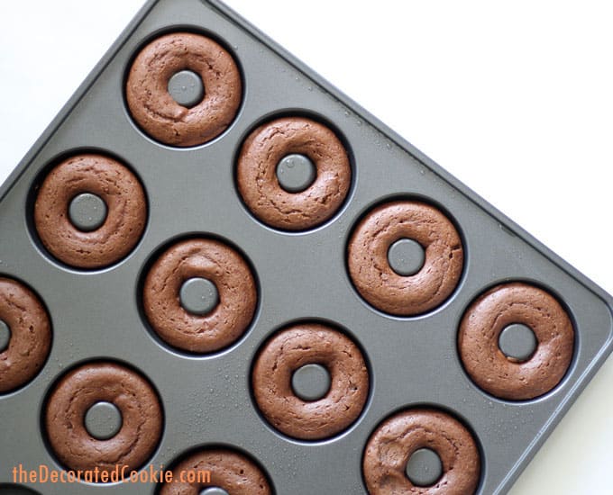 baked chocolate donuts in donut tray 
