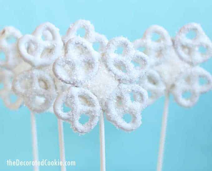 Easy snowflake pretzel pops, a cute and delicious fun food craft for Christmas and Winter. Video how-tos.