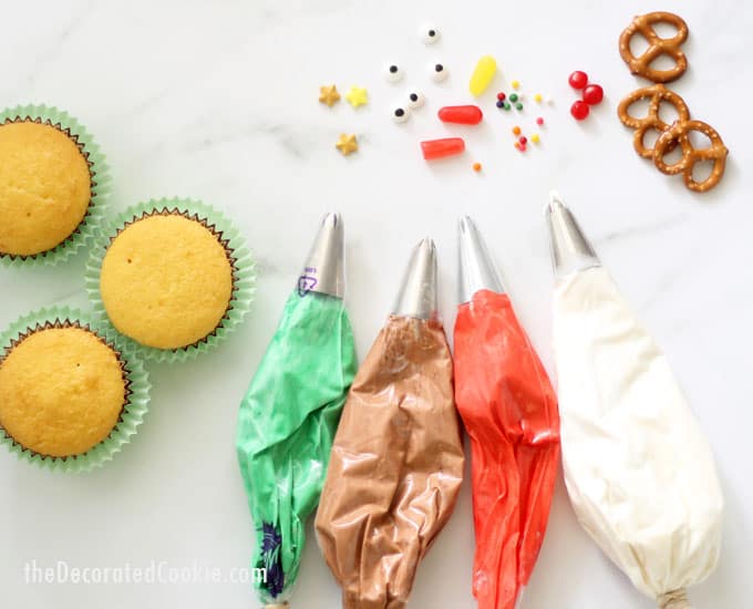 cupcakes with frosting bags 