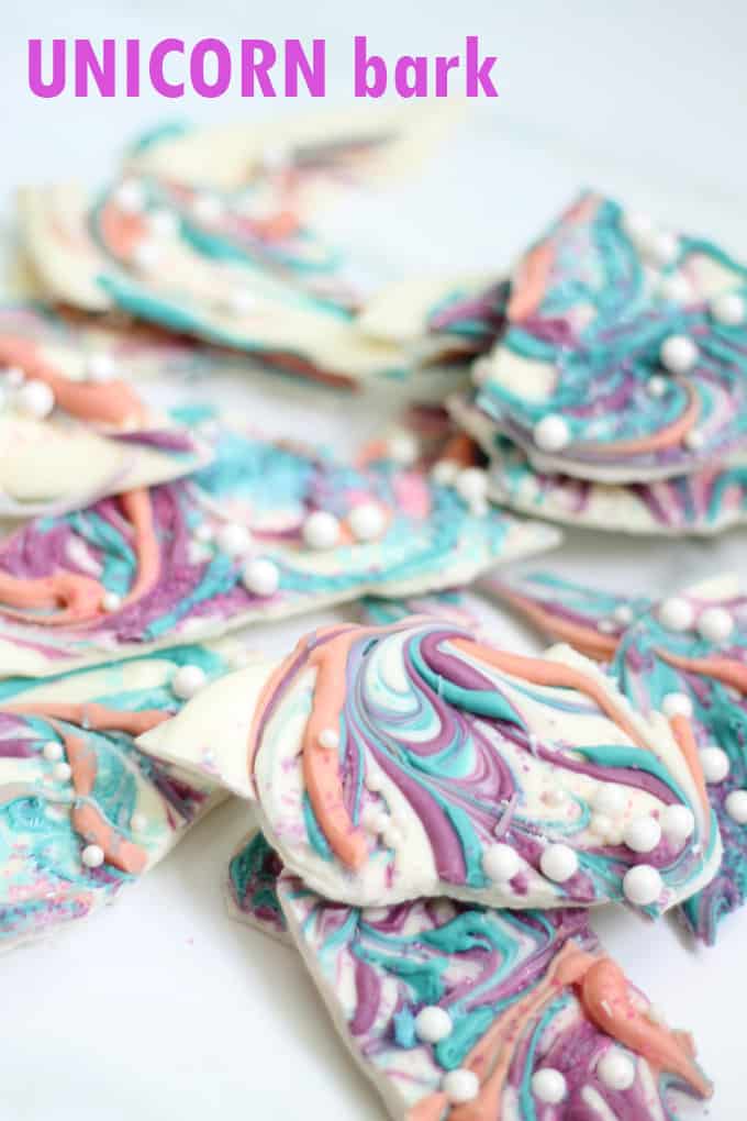 Unicorn food idea: Homemade unicorn bark is easy to make and delicious. With swirls of color and shimmering sprinkles, it's magical. Video recipe. #unicornfood #UnicornBark 