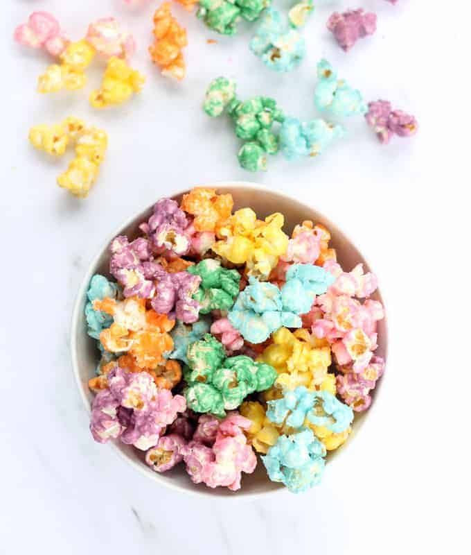 This colorful, candy rainbow popcorn is perfect for a rainbow or unicorn party. Colored popcorn recipe, awesome unicorn food. Video recipe included.
