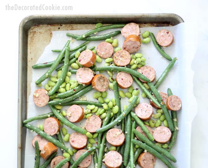 This kielbasa and green beans sheet pan dinner with edamame/soy beans is a delicious, low-carb, easy weeknight dinner idea that takes less than thirty minutes to make. Low-carb, gluten-free, keto dinner ideas. Video recipe included. 