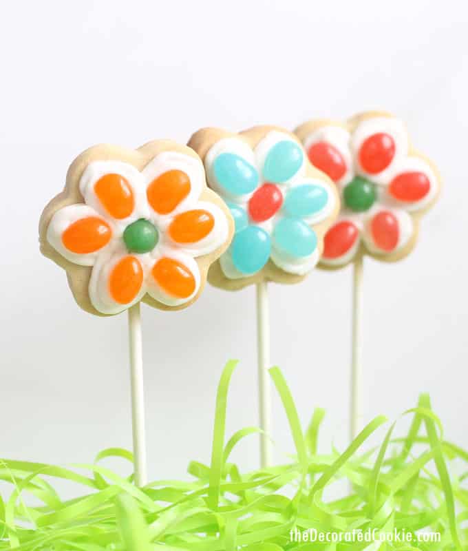 These jelly bean flower cookies on a stick are a cute and easy treat to make for Spring and Easter. #EasterDesserts #EasterTreats #SpringFlowers #FlowerCookies #JellyBeans #JellyBeanCookies #EasterCookies