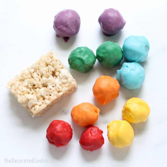 how to make rainbow rice krispie treat bites, the perfect, bite-size fun food for a rainbow or unicorn party. Also great for St. Patrick's Day food ideas. 