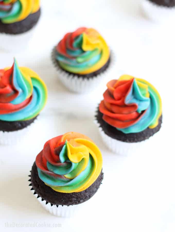 A step-by-step tutorial, with video, how to decorate rainbow swirl cupcakes with buttercream frosting. Easy, fun dessert for a rainbow or unicorn party. #rainbowfood #unicornfood #RainbowParty #cupcakes #buttercreamfrosting #RainbowSwirl 