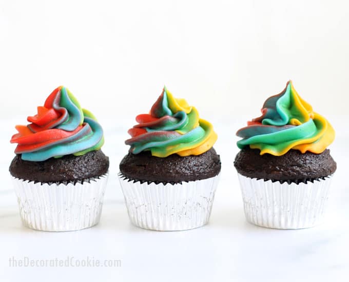 A step-by-step tutorial, with video, how to decorate rainbow swirl cupcakes with buttercream frosting. Easy, fun dessert for a rainbow or unicorn party. #rainbowfood #unicornfood #RainbowParty #cupcakes #buttercreamfrosting #RainbowSwirl 